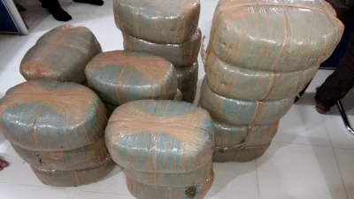 বাদামের পার্সেল ভেঙে ধরা পড়ল সাড়ে ১৪ কেজি গাঁজা
